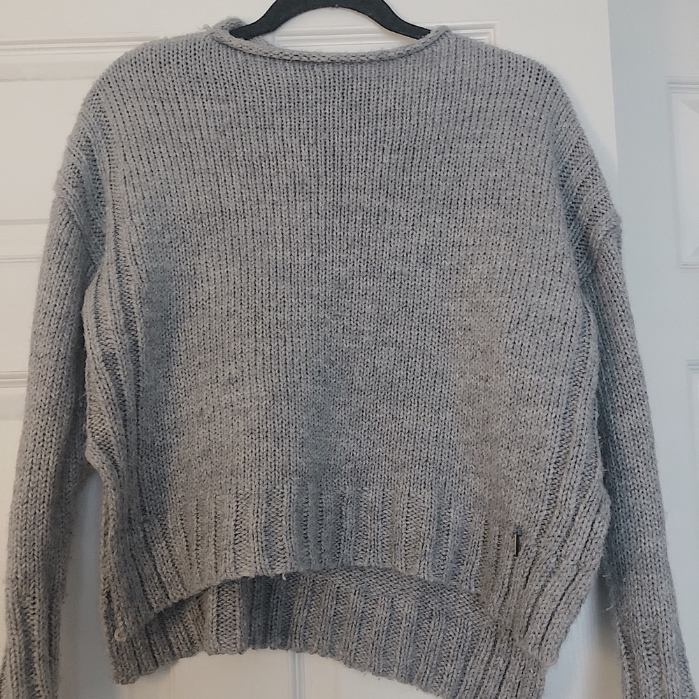 grey sweater.